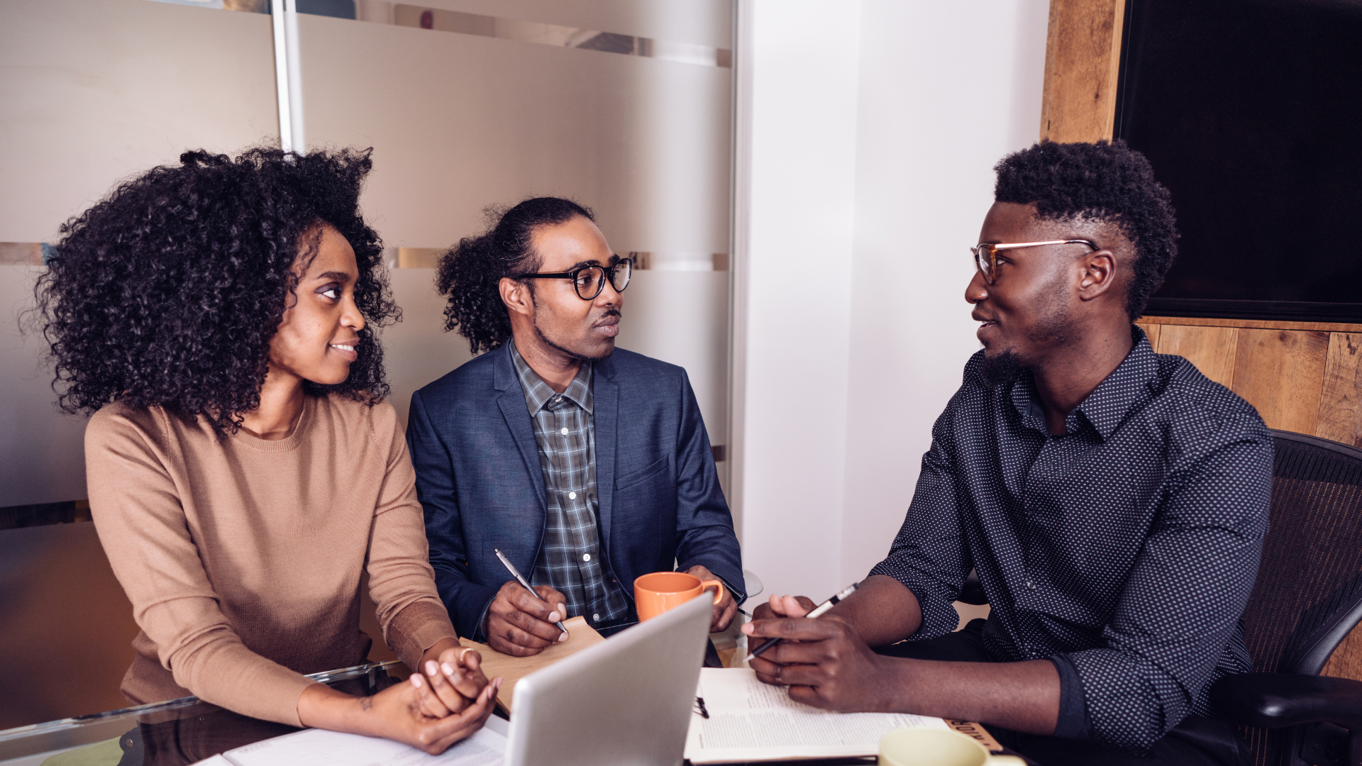 three people in a business meeting