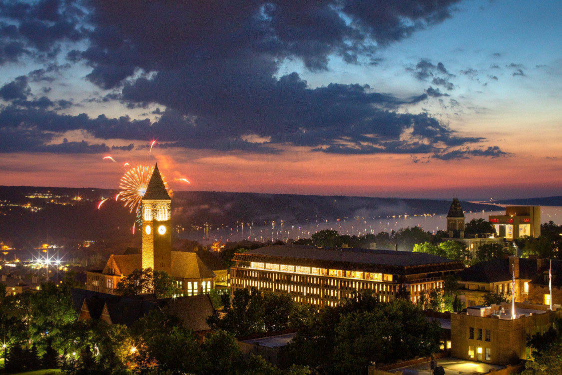 Fireworks display over Cornell's campus during sunset