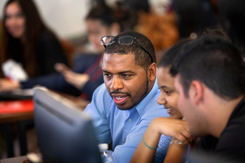 Cornell computer science professor Hakim Weatherspoon helping students.