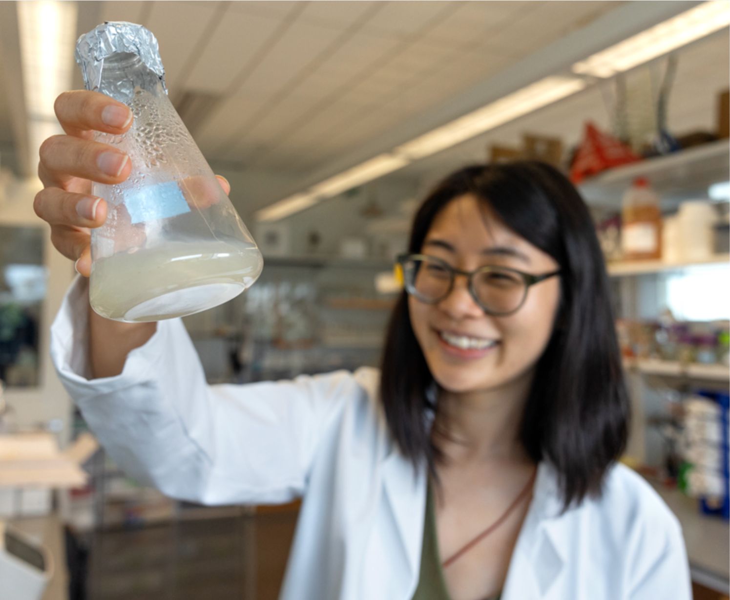 Person holding up vial